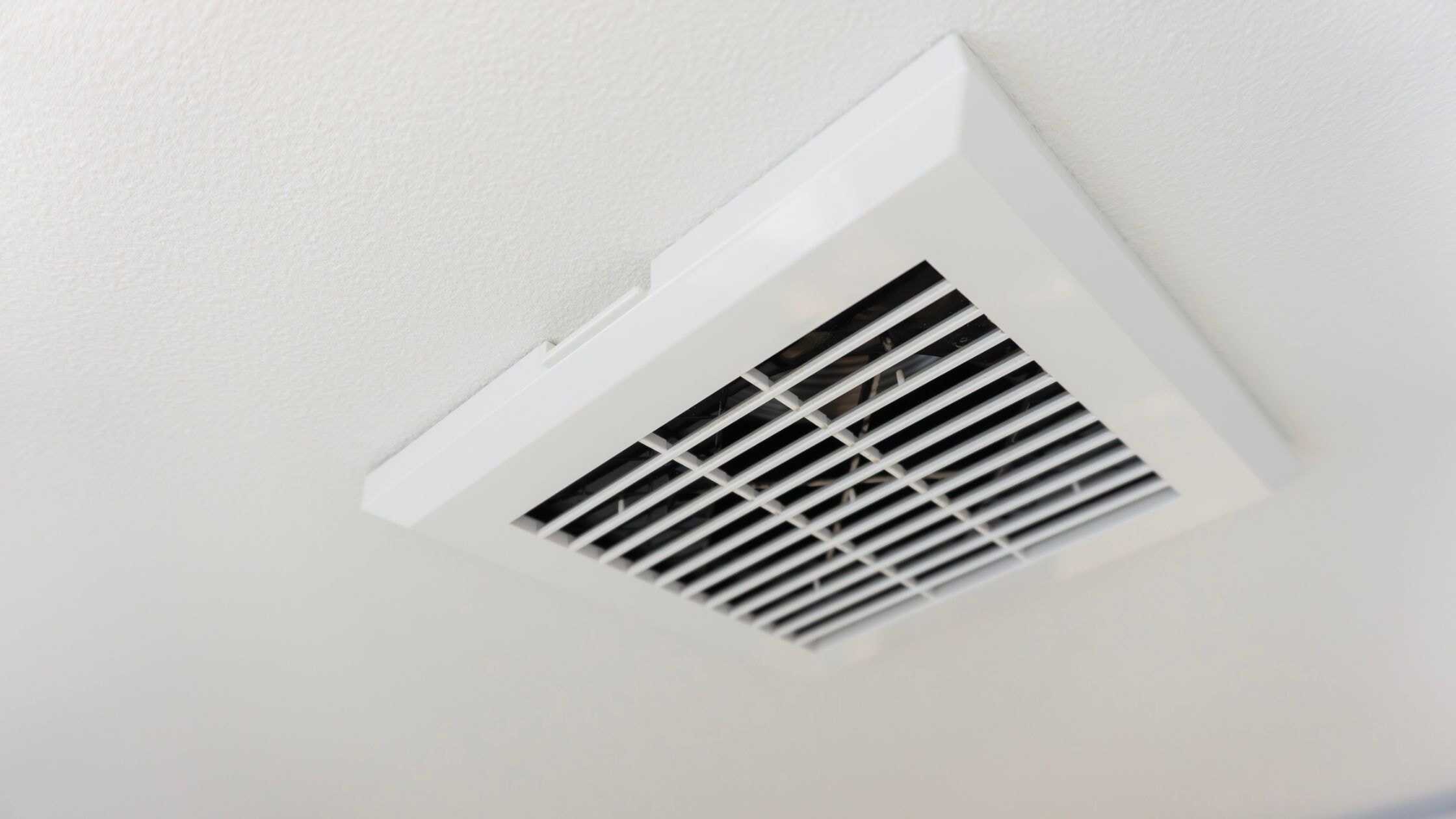 Modern bathroom exhaust fan installed in ceiling for improved air circulation.