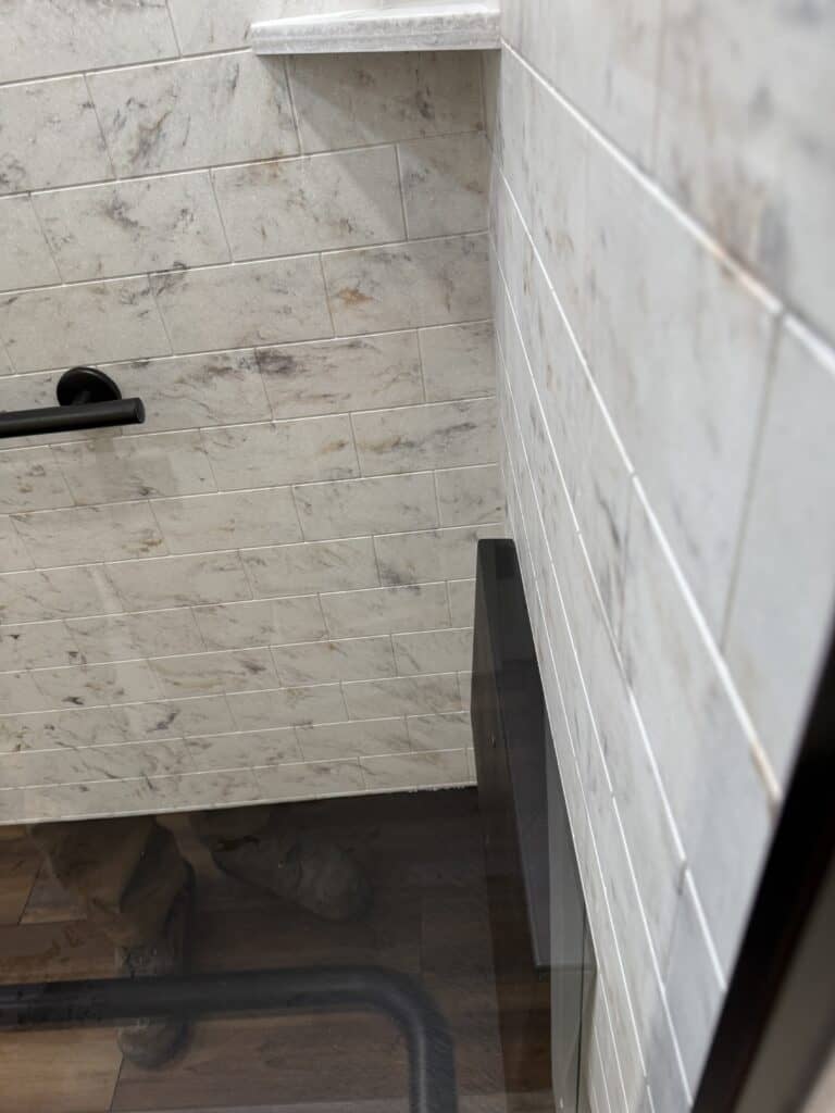 Bathroom wall tiles with a marble finish for a modern and elegant look.