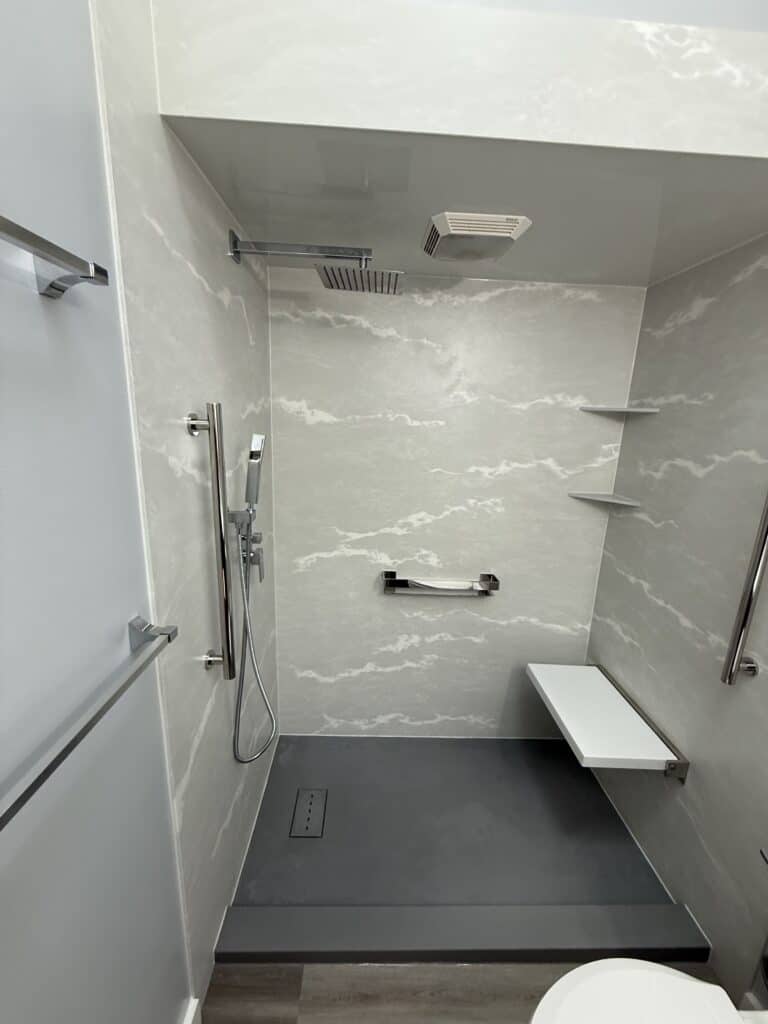 Accessible walk-in shower with modern fixtures.